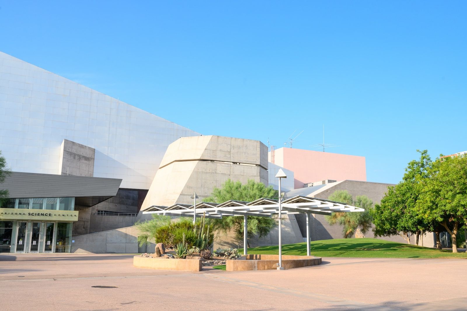 The exterior of the Arizona Science Center building and entrance plaza under a blue sky