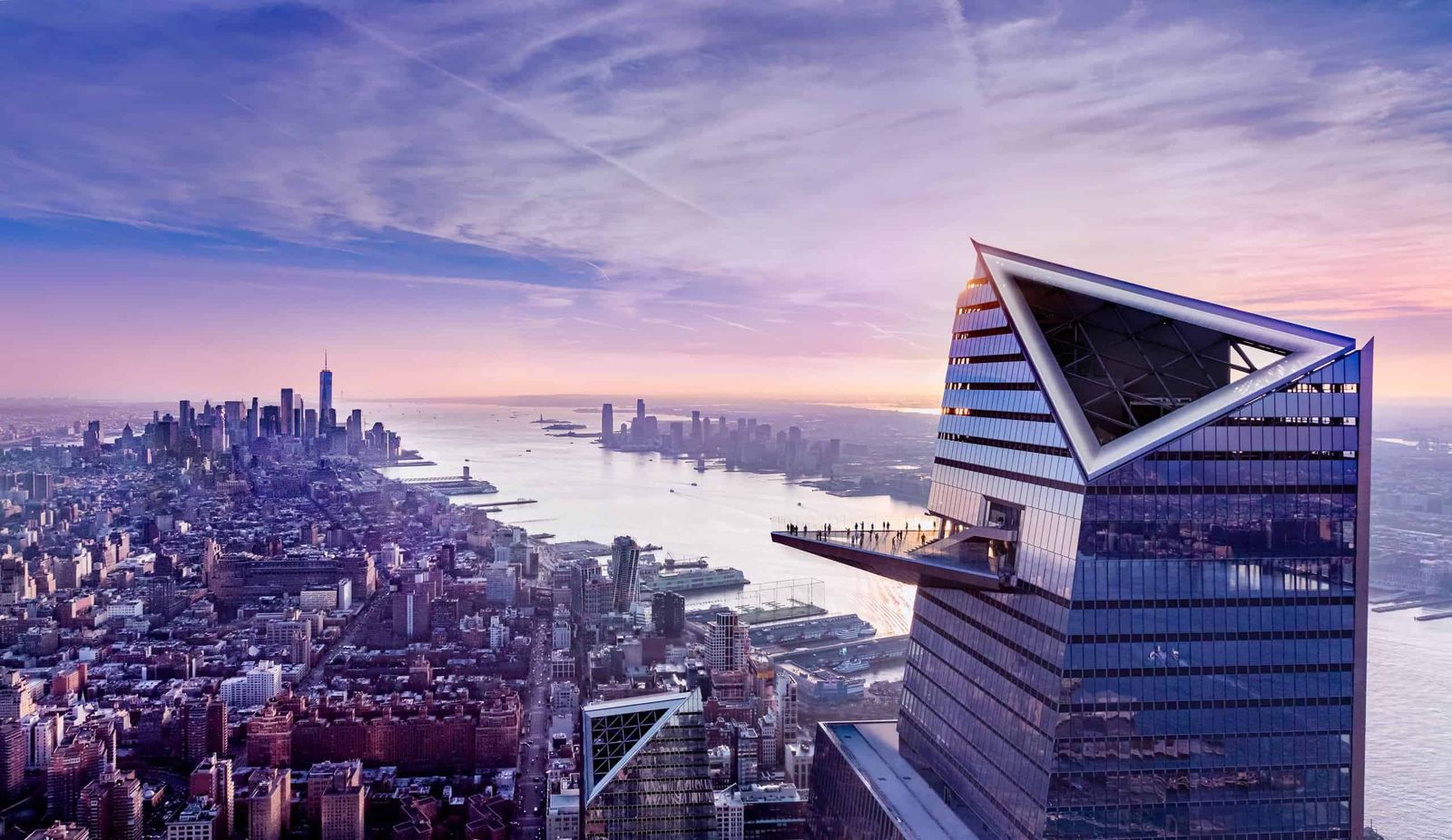 Aerial view of the Edge observation deck jutting from a tower above the Manhattan skyline at dusk