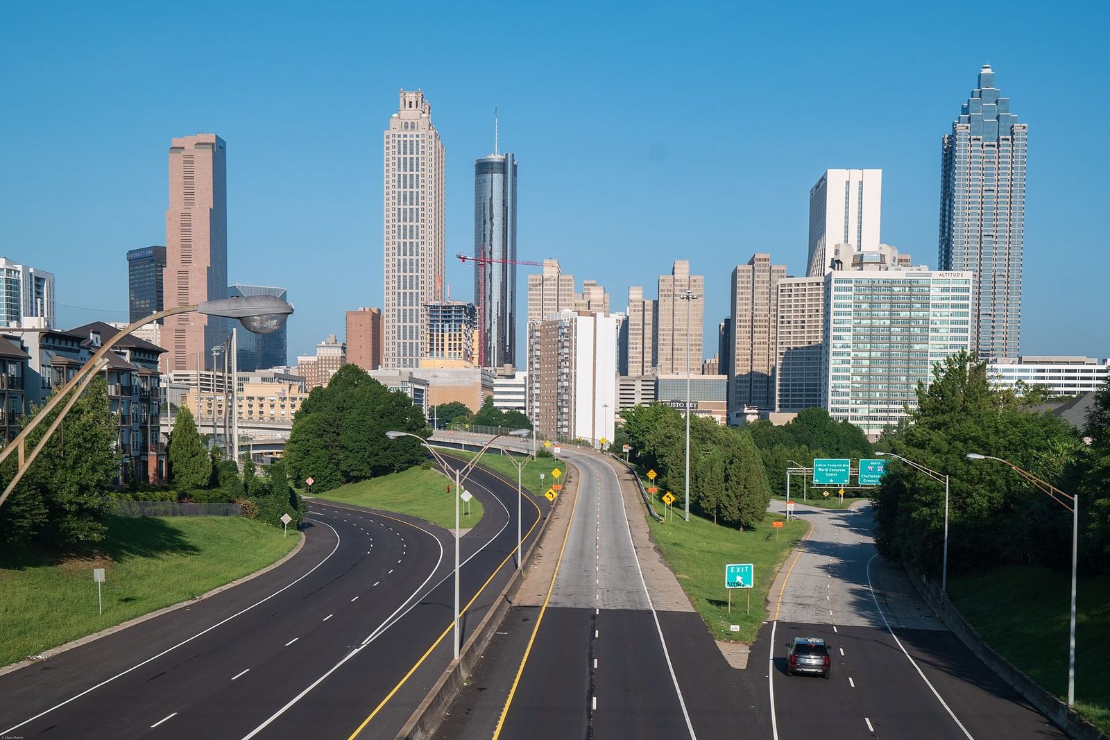 The Atlanta skyline seen along an empty highway from a bridge on a clear day