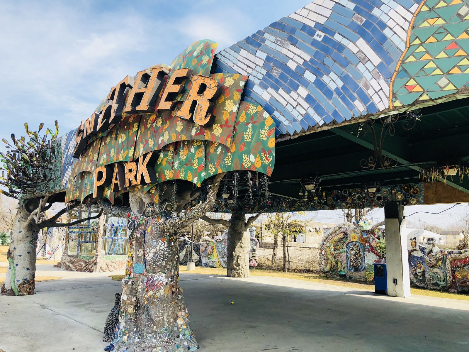 The mosaic-covered entrance of Smither Park with its sign and tiled canopy
