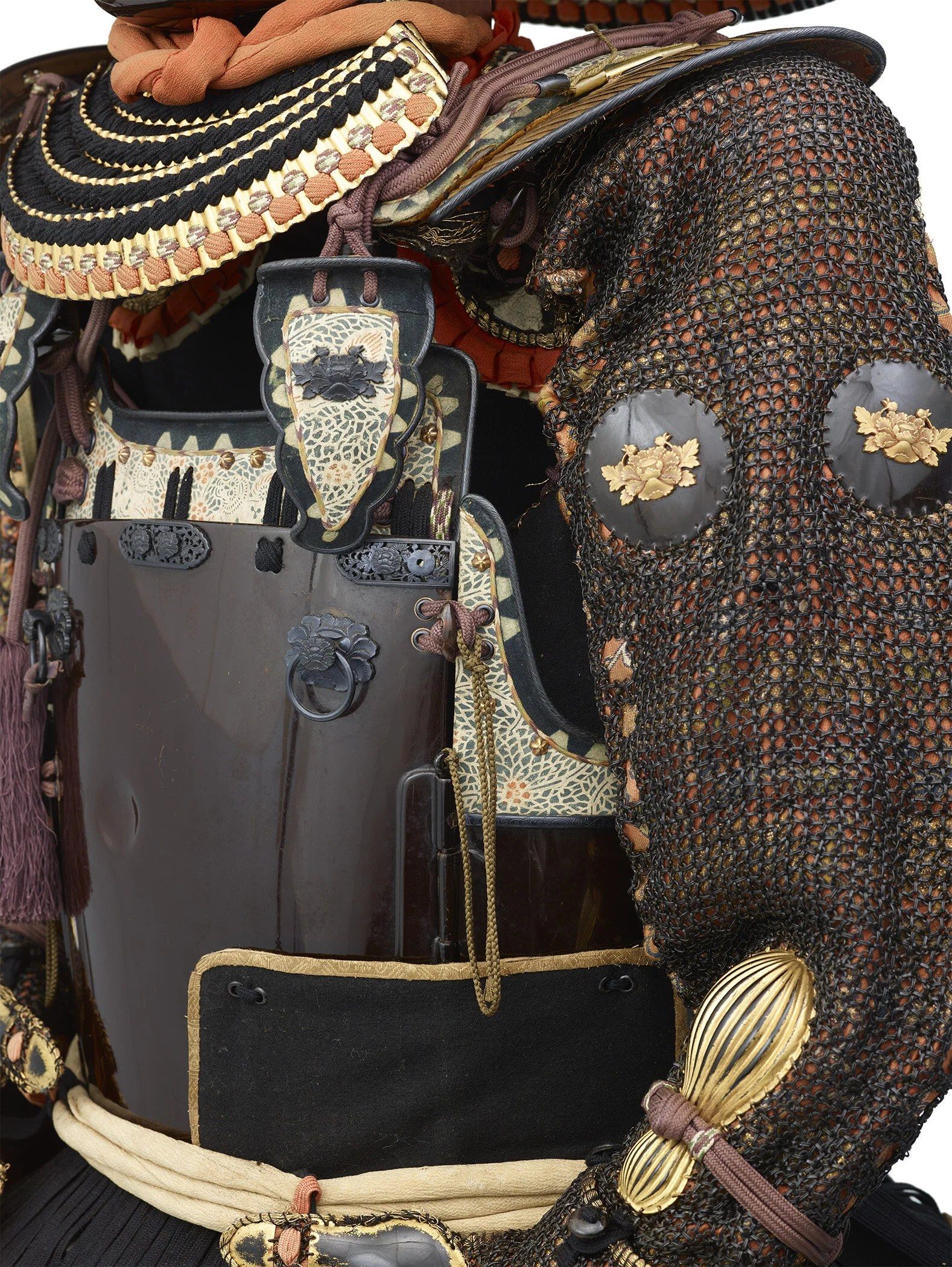 Suit of samurai armor with chainmail sleeves and a dark breastplate on display